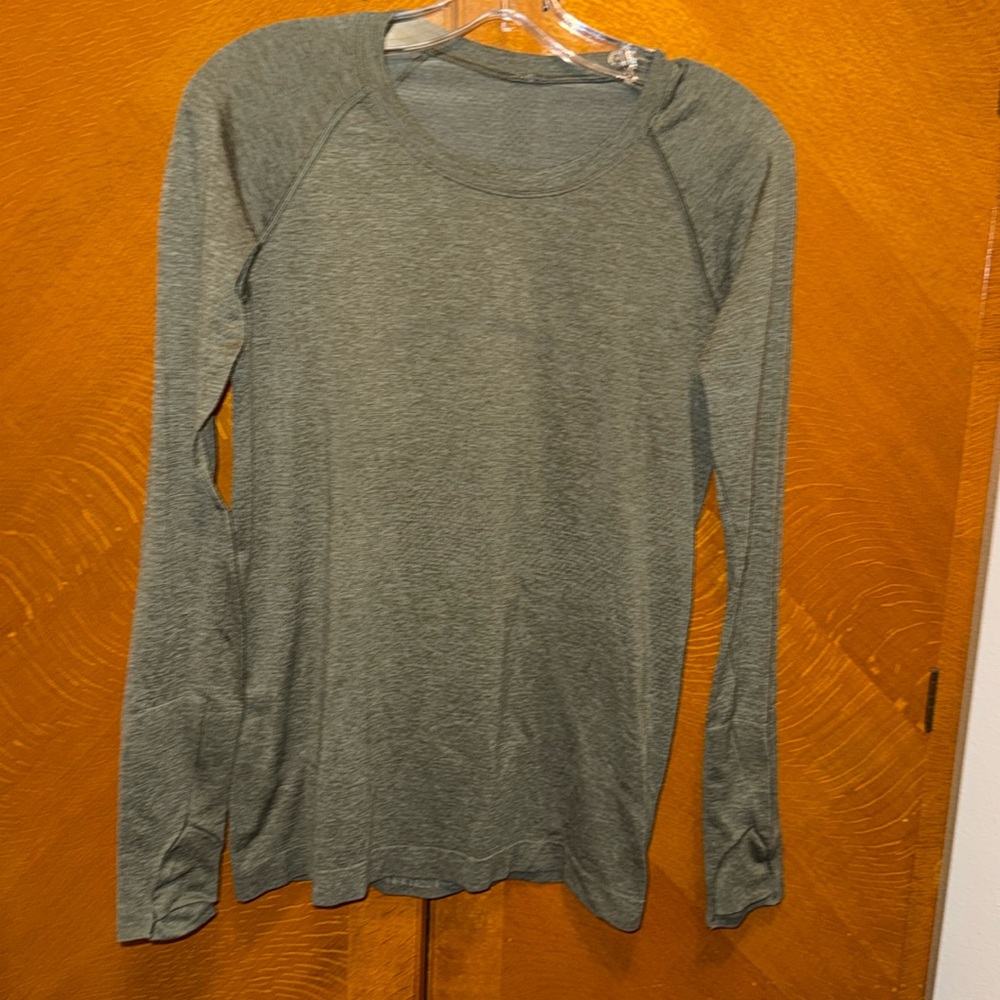 Lululemon long sleeve top in olive green color .